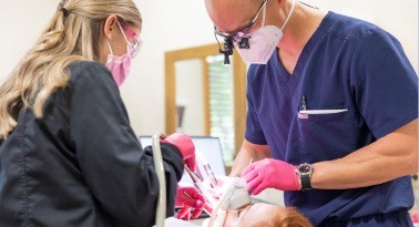 Woman visiting an emergency dentist in Columbia