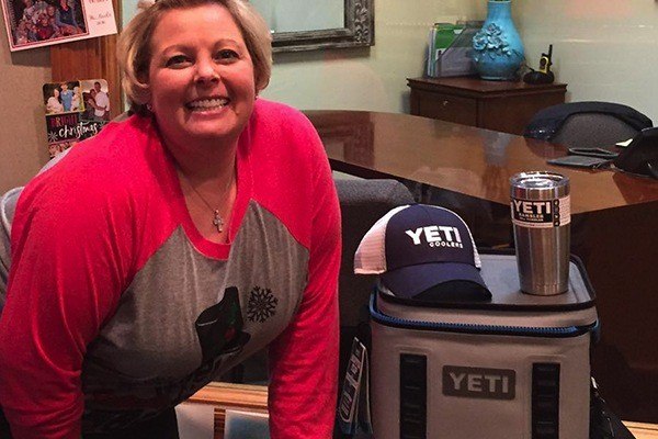 Patient posing with yeti products