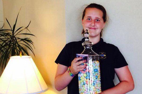 Young girl with jar of gum drops