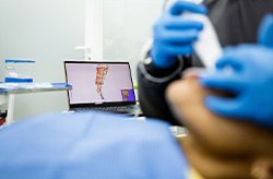 Dentist making digital impressions of patient’s teeth