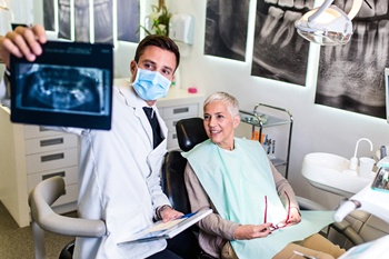 Woman smiling during her dental consultation
