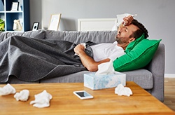Man resting at home with a cold or flu