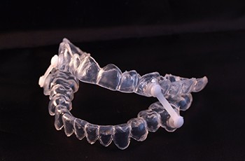 Oral appliance on a black background