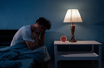Man awake in bed