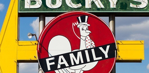Sign with the word family and a cartoon rooster on it