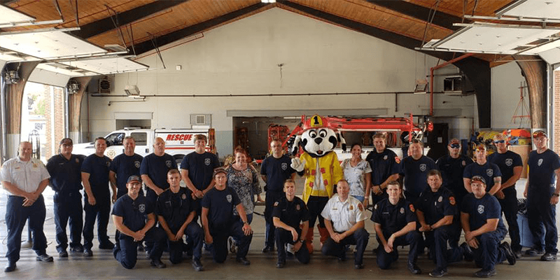Dental team members and fire fighters at fire department