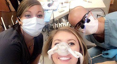 Patient with nitrous oxide sedation dentistry nasal mask