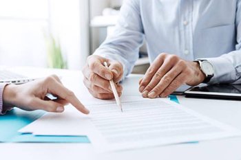 Two people reviewing financial information