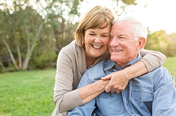 Couple outside with dental bridge in Columbia