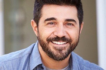 man smiling with dental crowns in Columbia