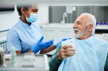 a patient talking to a dentist in Columbia
