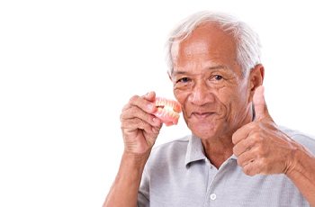 Man giving thumbs up for dentures in Columbia