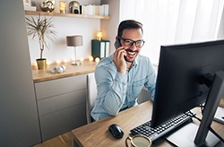 man smiling while working