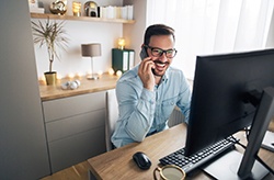 man smiling while working 