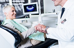 dentist and patient discussing the cost of dental implants in Columbia