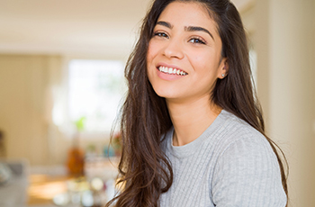 woman smiling after a smile makeover