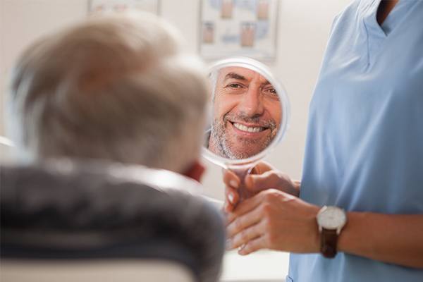 man smiling in mirror