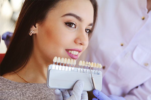woman comparing dental implants