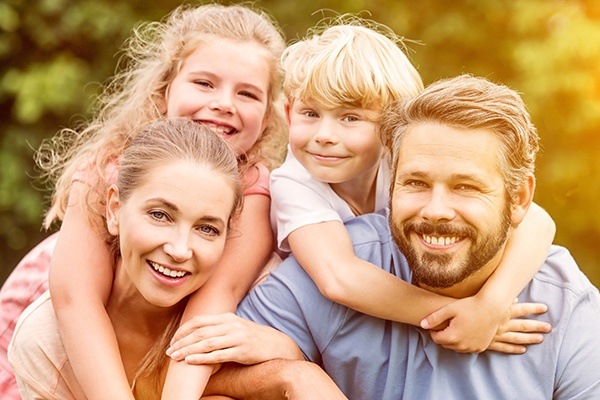 smiling family outdoors