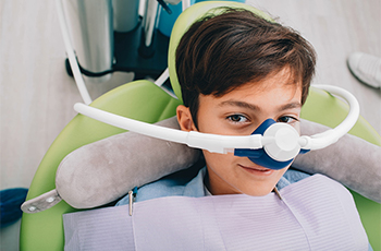 child with a nitrous oxide sedation dentistry mask over their nose