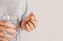 Woman taking pill