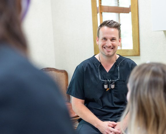 photo of Dr. Philip Matthews With Patient smiling