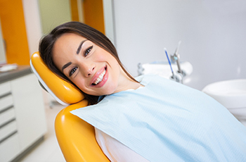 Woman smiling after a full mouth reconstruction