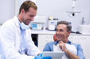 Man smiling after root canal therapy in Columbia