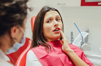 Woman at dentist needing root canal in Columbia