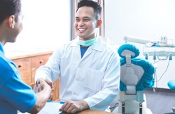 Dentist talking to a patient