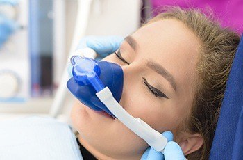 Woman with nitrous oxide sedation dentistry mask