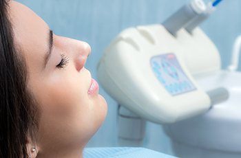 Relaxed woman in dental chair during I V dental sedation visit