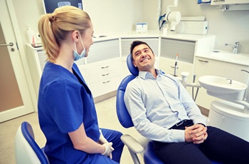 man smiling at his cosmetic dentist in Columbia, TN