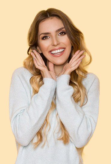 Woman with long blonde hair showing off her smile