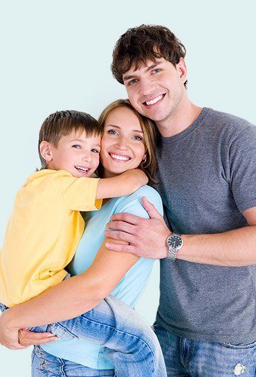 Smiling mother and father holding their child