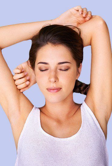 Relaxed woman with her hands behind her head and her eyes closed