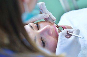 Relaxed woman in dental chair during sedation dentistry visit