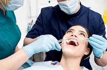 Dentist performing TMJ treatment in Columbia on patient