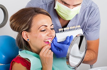 woman trying on porcelain veneers in Columbia 