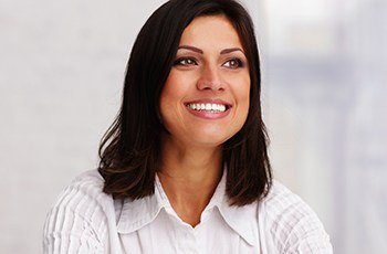 Woman with bright smile after teeth whitening