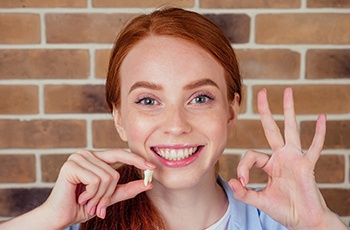 Teenage girl smiling after wisdom tooth extraction in Columbia