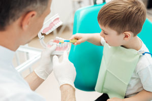 Child talking to dentist