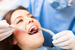 Woman smiling in dentist's chair.