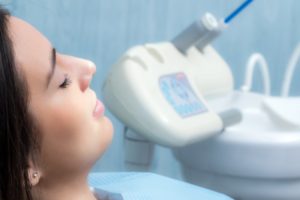 Woman relaxing in dental chair with IV sedation in Columbia