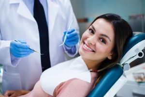 Woman sitting in the dental chair smiling