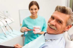 man at a consultation for dentures in Columbia 