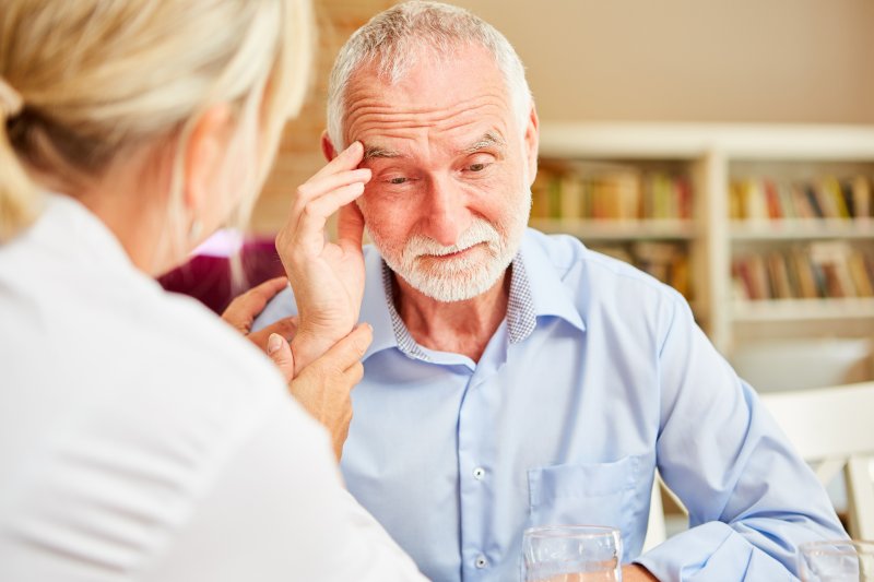 an older man struggling to remember because of Alzheimer’s disease in Columbia