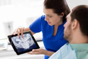 a patient visiting their dentist for wisdom tooth extraction in Columbia