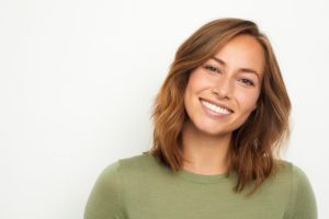 a patient smiling after full mouth reconstruction in Columbia