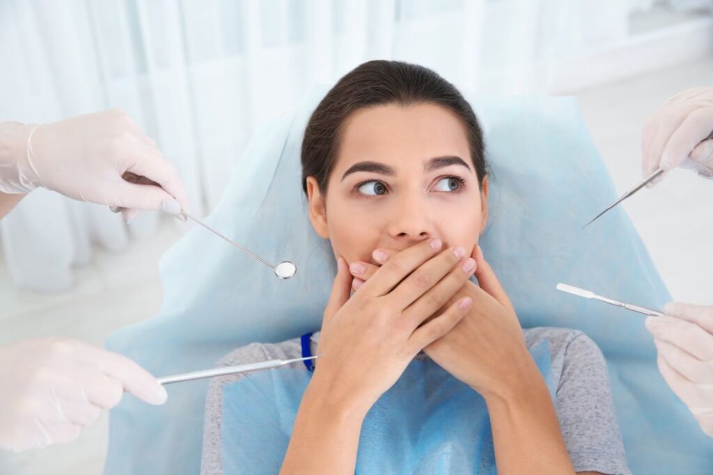 A woman who is afraid of the dentist